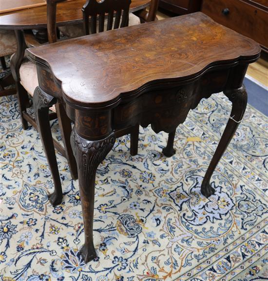 A 19th century Dutch marquetry card table W.71cm